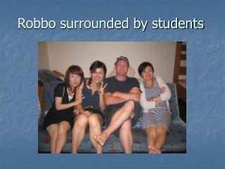 Robbo surrounded by students