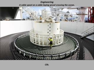 Engineering A cable spool on a cable laying yessel crossing the ocean.