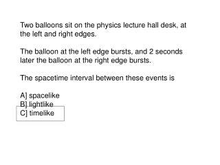 Two balloons sit on the physics lecture hall desk, at the left and right edges.