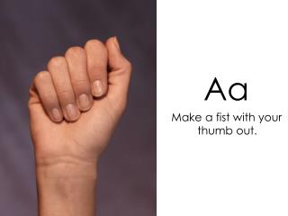 Aa Make a fist with your thumb out.